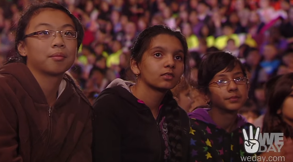 Kids listenting to Martin Sheen's We-Day motivational message.