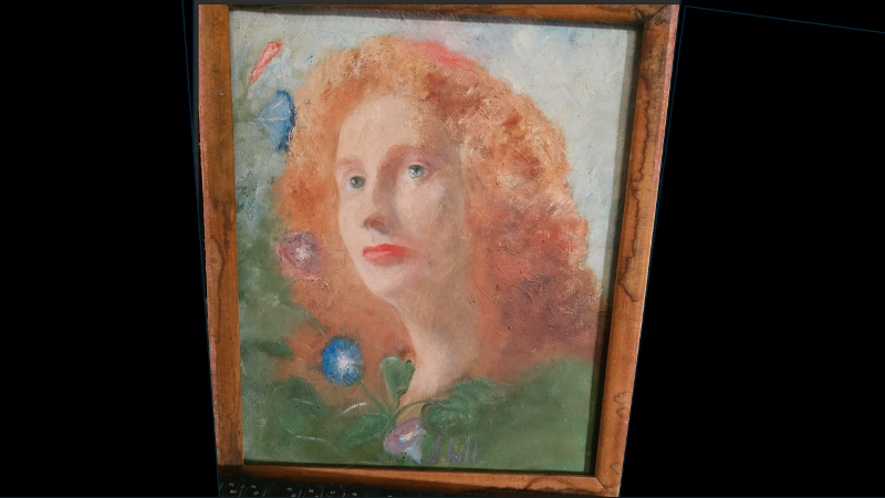 Portrait of a woman with fluffy red hair.